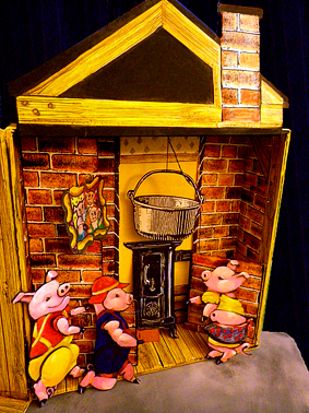 Animation anniversaire à domicile : Les 3 Petits Cochons et la maison de briques.